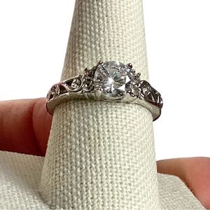 Silver-tone Solitaire Ring w/ 6 Small Crystals Aside the Large Crystal Size 8.5
